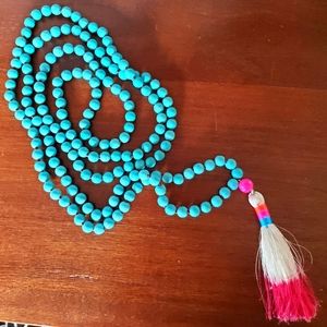 Long turquoise wood bead necklace with tassel